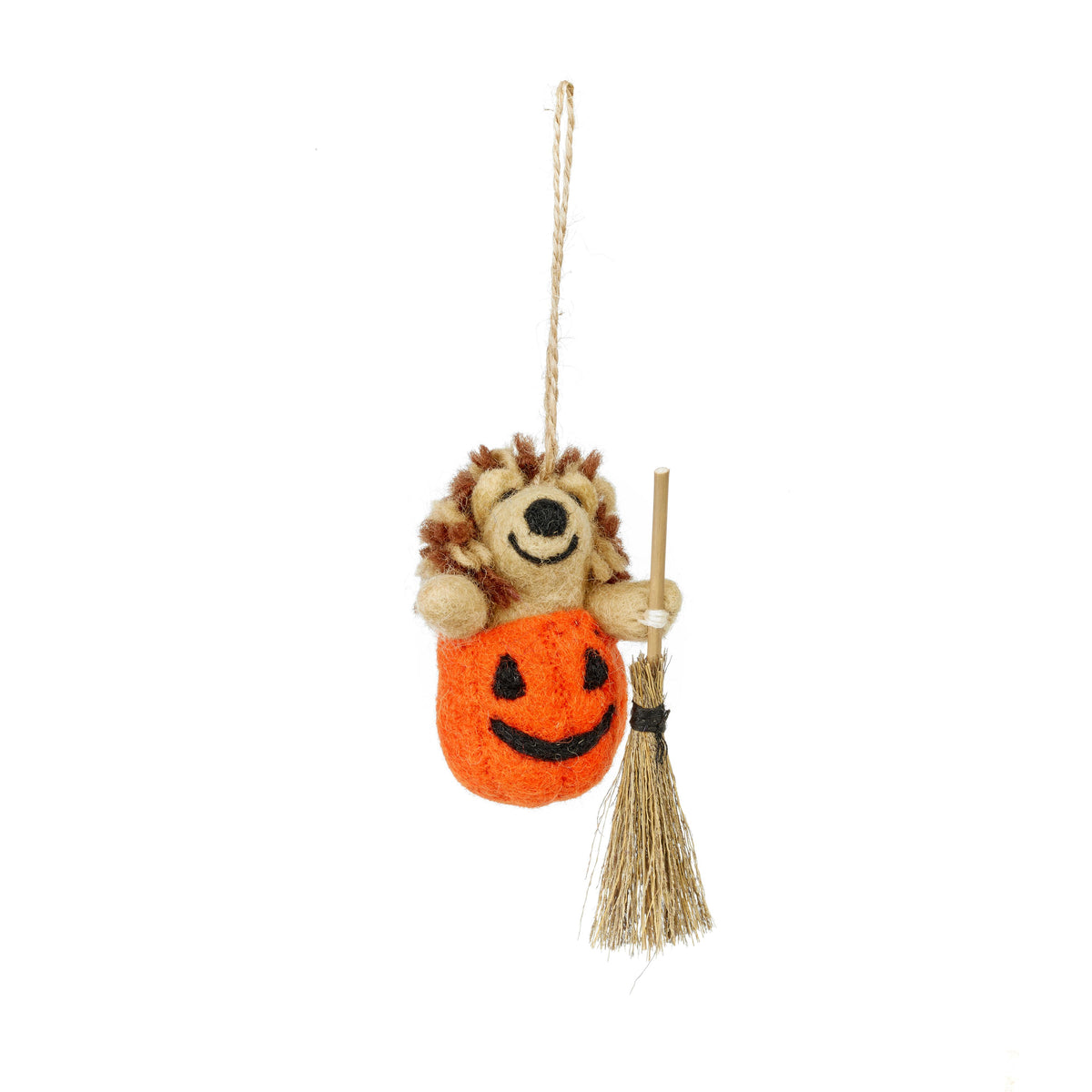 Handmade felt Halloween hedgehog in a pumpkin with a broom