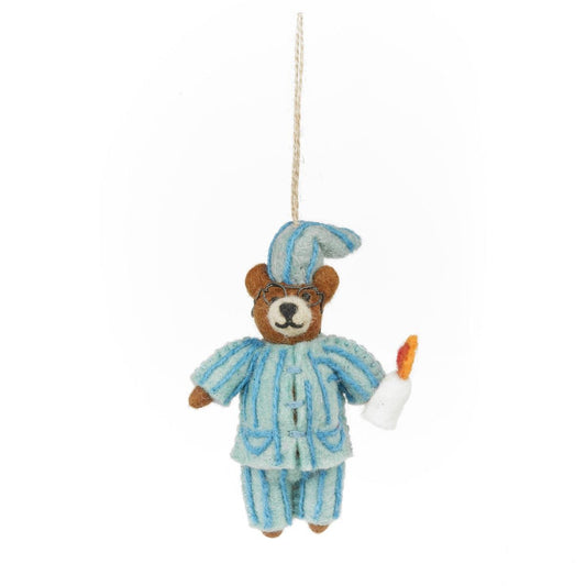Handmade felt bear Christmas hanging decoration wearing pyjamas and holding a candle